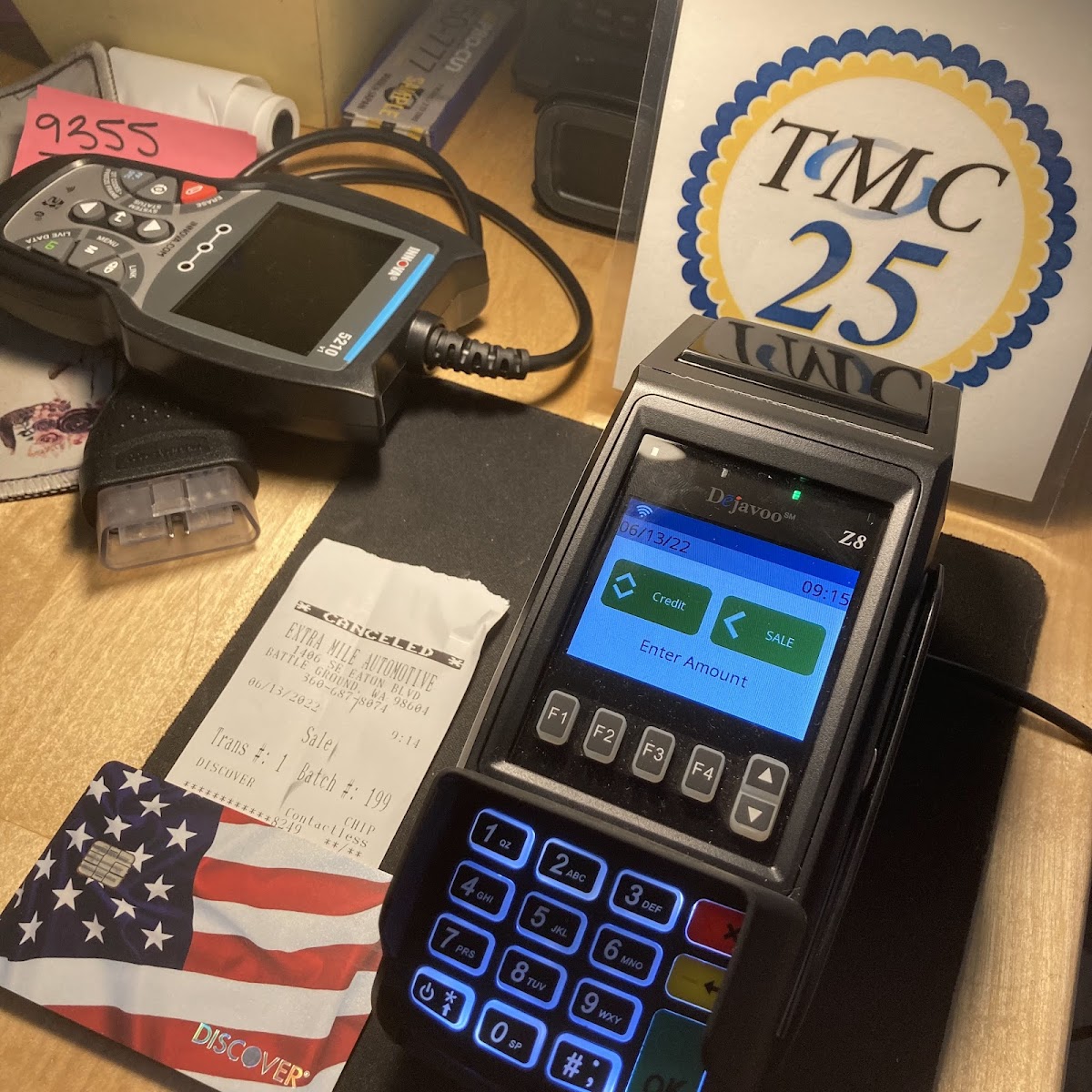 Diagnostic scan tool and card payment terminal at the Extra Mile Automotive counter